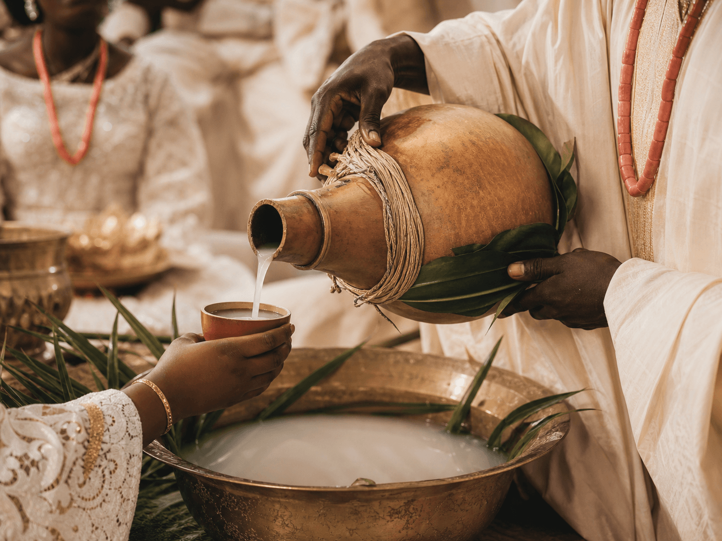 Fresh palm wine being presented during an elegant traditional ceremony