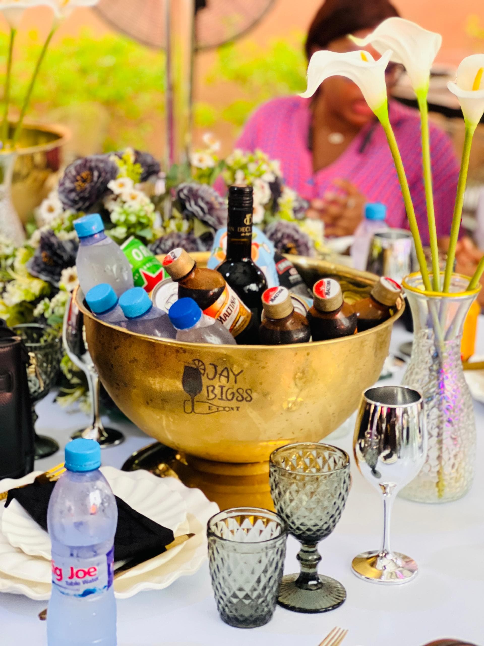 Dignified beverage service with white florals at a memorial reception