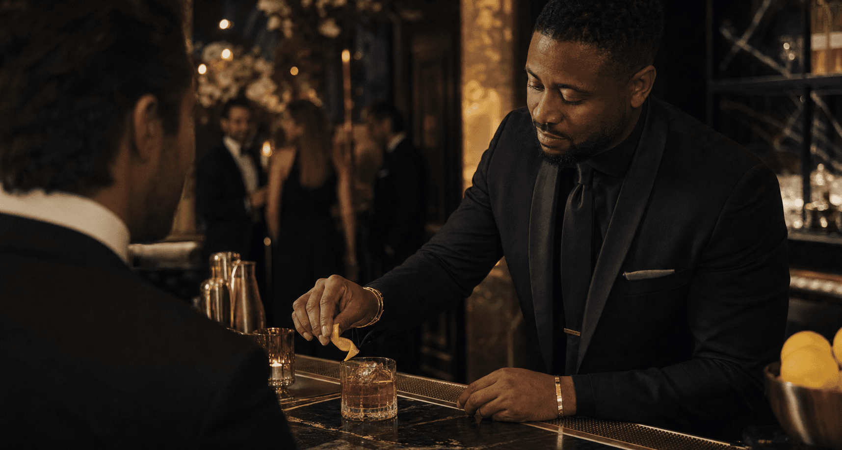 Bartender finishing a signature cocktail for a guest at a private event